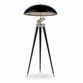 Black tripod floor lamp with metal shade and adjustable light height